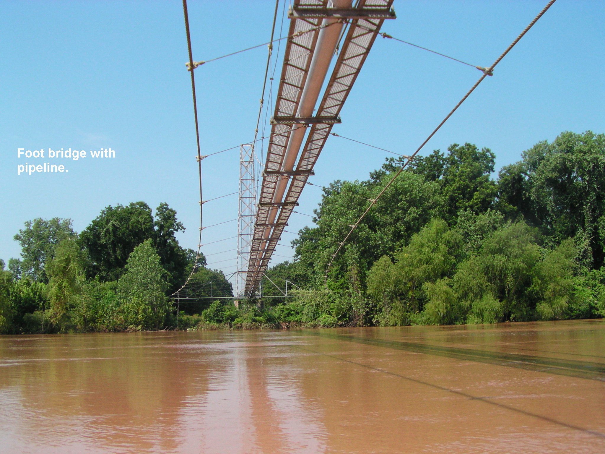 The pipeline has a foot bridge built in. This is the only walkway that crossed the river below Richmond.